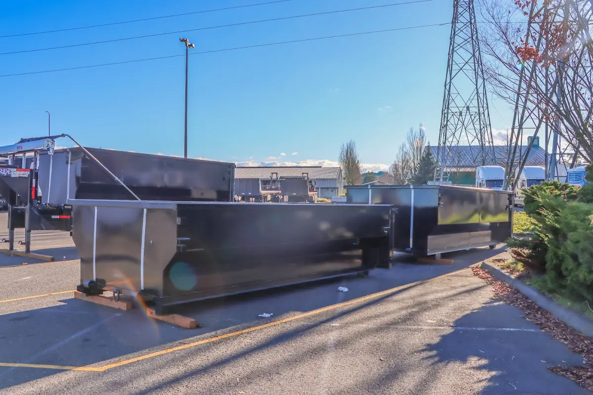 Roll-off dumpster ready for waste disposal at job site for 15 Yard Dumpster Rental in Corinth